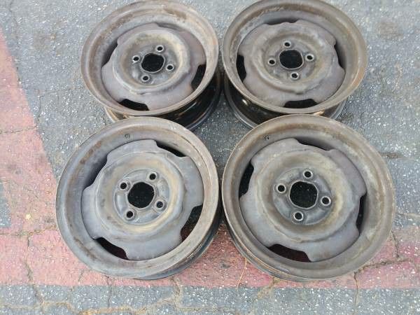 14 inch four lug steel rims Mustang and more. 4x108mm
