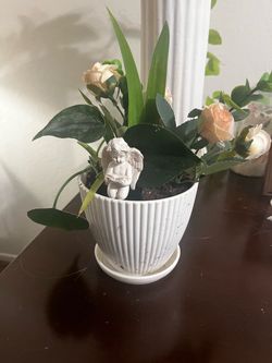 Beautiful Floral Arrangement in White Ceramic Pot with Angel Figurine