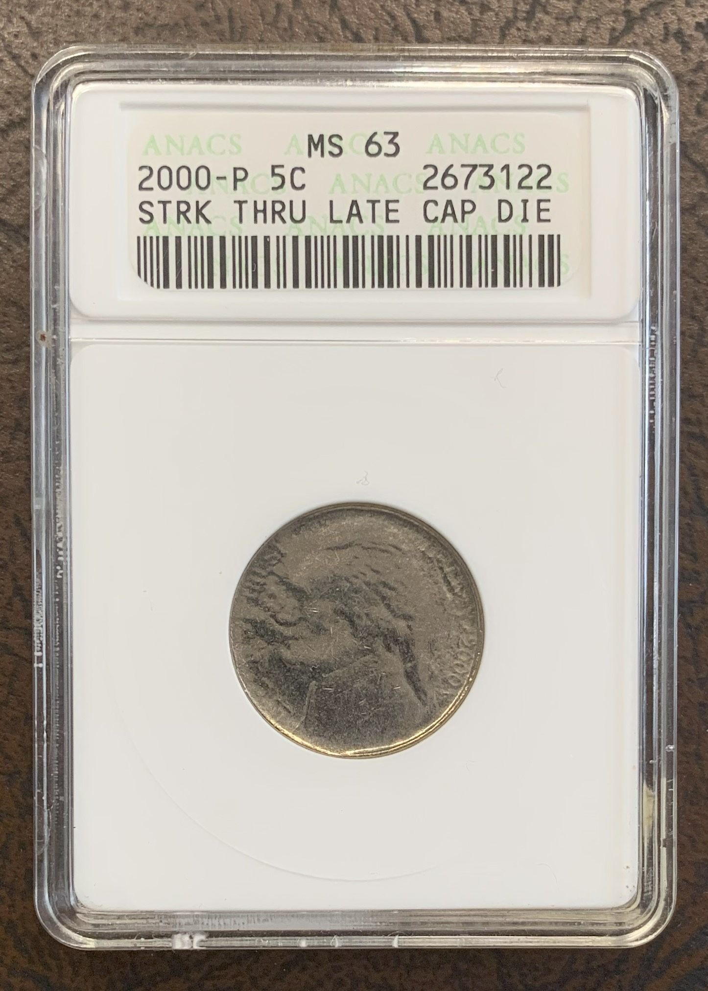 MS63 Graded Struck Thru Late-Stage Capped Die Jefferson Nickel Mint Error