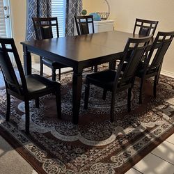 Brown table and brown rug