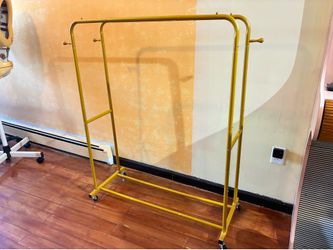 Rolling double clothing rack