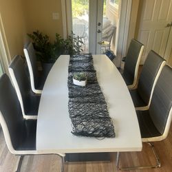White Acrylic Table With Stainless Steel Leg And 6 Chairs 