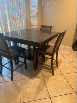 Counter height dining table set with lazy Susan and 3 matching chairs