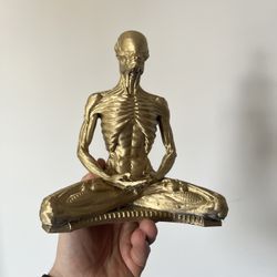Golden Alien Buddha Statue. 
