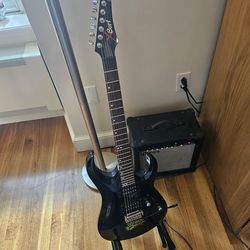 FULL ELECTRIC GUITAR SET with Xcort soloist guitar, cable, and amplifier