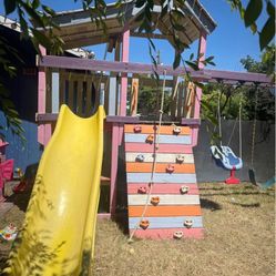 huge snd heavy wooden swingset $400 price if firm no lower I will help take apart if needed