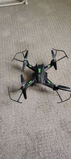 Dron con control dé color negro con verde