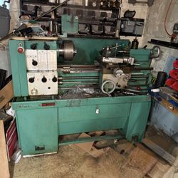 HARRISON M300 LATHE WITH VARIOUS ADAPTERS . BUYER MUST DISASSEMBLE, PICK UP AND DELIVER. $1000.00 OR BEST OFFER.