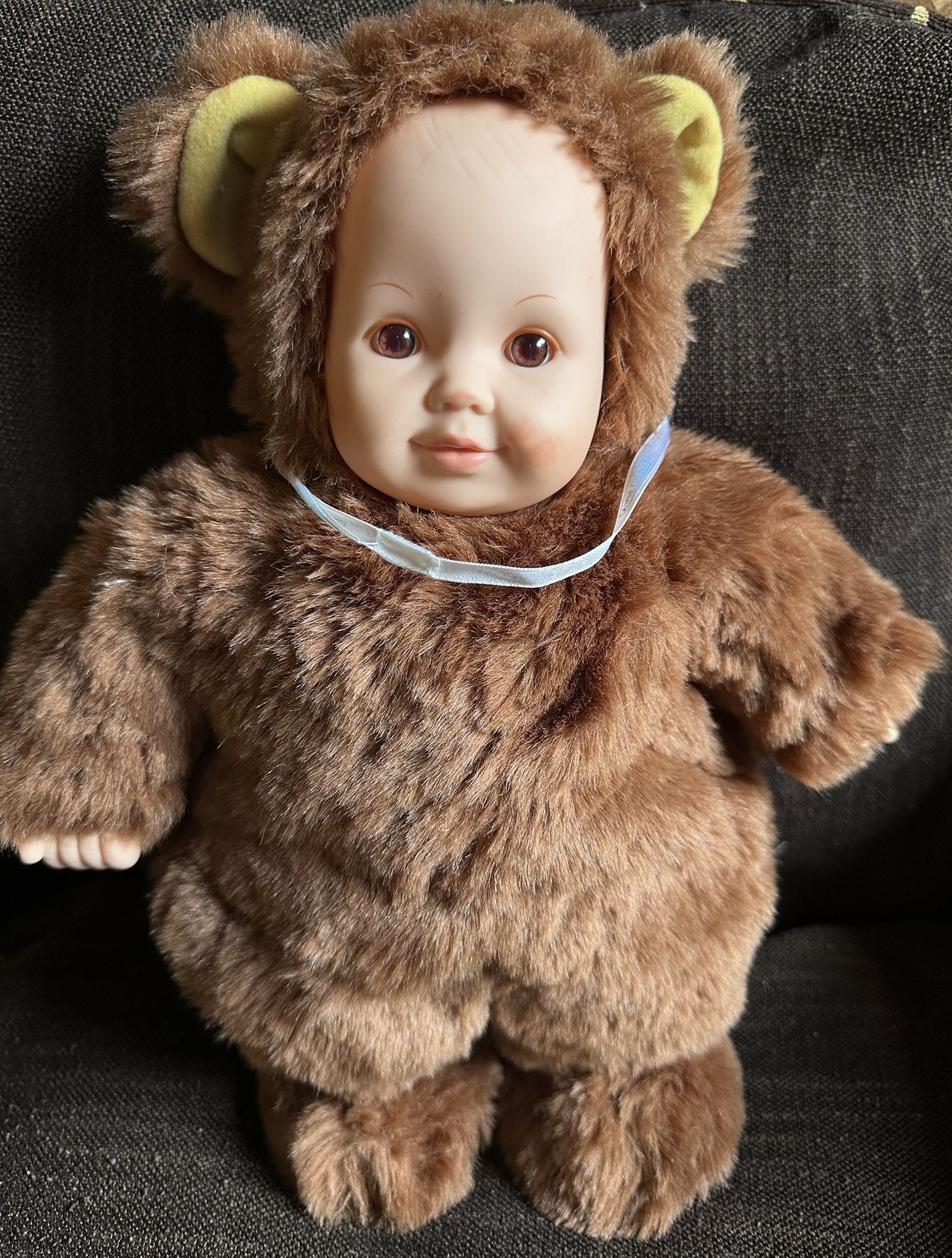 1997 UNIMAX Anne Geddes 15" baby doll with beautiful brown eyes in good condition has a little red mark on cheek. Stamped on the back of her neck 199