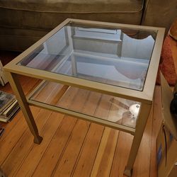 Square gold/brass and glass coffee table
