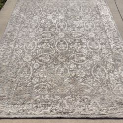 Selling a BIG RUG – 114 x 94 inches.