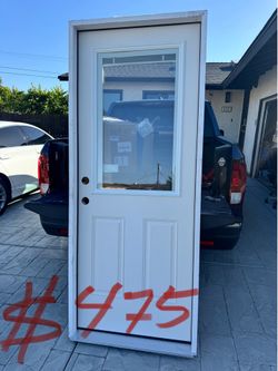 Preciosa puerta nueva de exterior de fiberglass zise 32x80 con pecianas por en medio