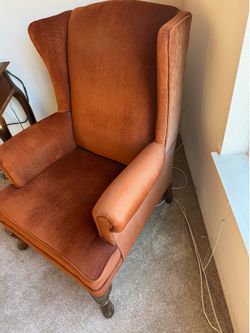 Wing back chair. Rust colored velvet