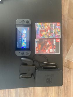Nintendo switch 32gb, with 4 games barely used