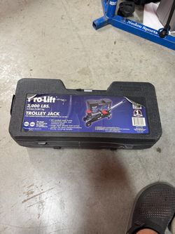 Pro-Lift F-2315PE 1.5-Ton (3,000 lbs) Hydraulic Trolley Jack with its carrying handle and storage case (used one time).