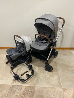 Nuna Triv Stroller with Car Seat with white canopy
