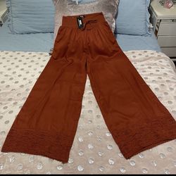 NAOO wide leg pants, with embroidery at the bottom, pockets and elastic waist, 100% rayon, new with tags.size Medium - Large. 