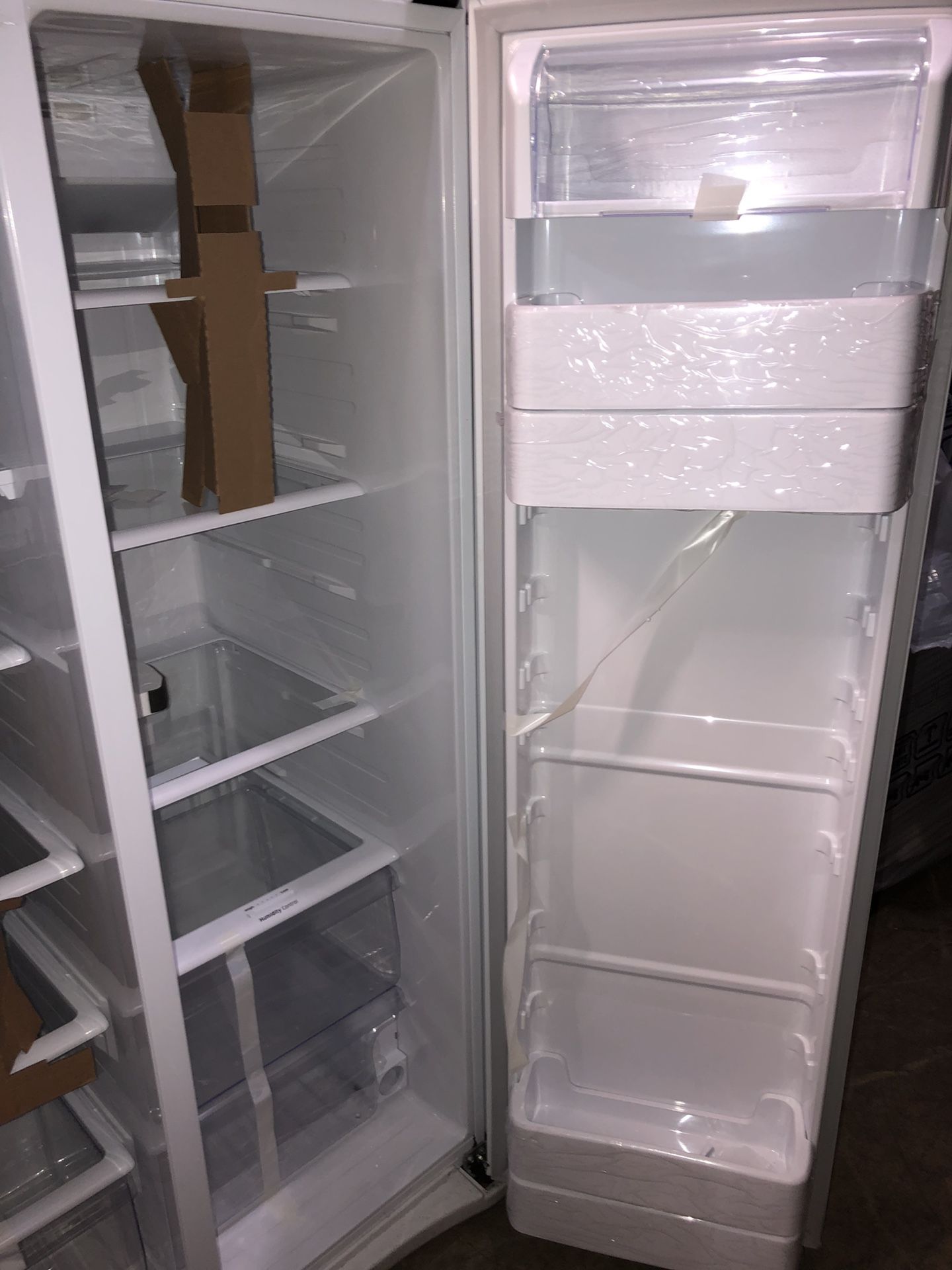 samsung white side by side fridge with water/ice dispenser