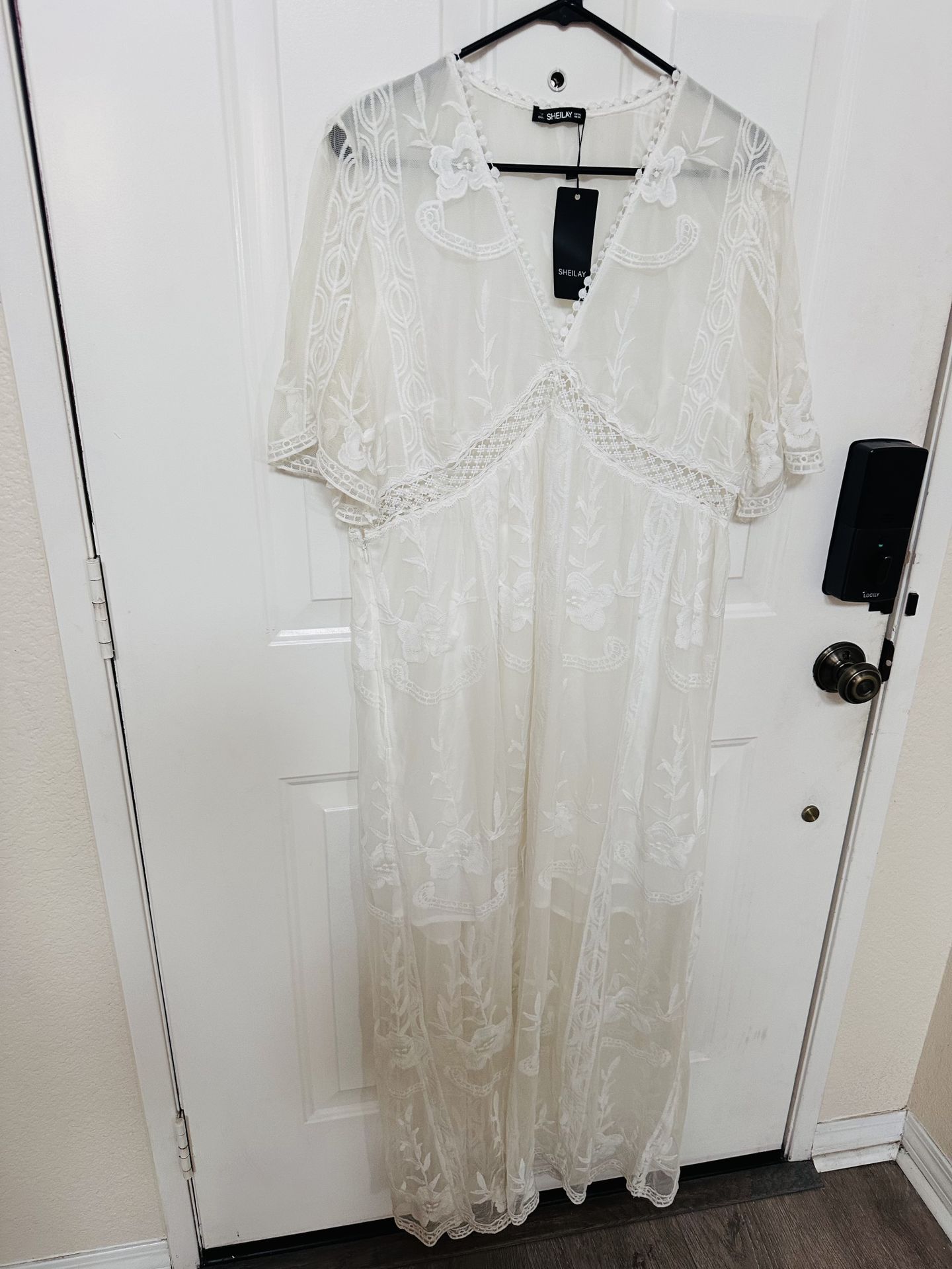 white lace maxi dress from the brand Sheilay.
