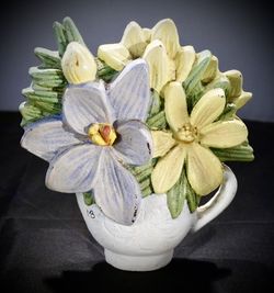 Marjolein Bastin cast iron teacup and flower doorstop. 