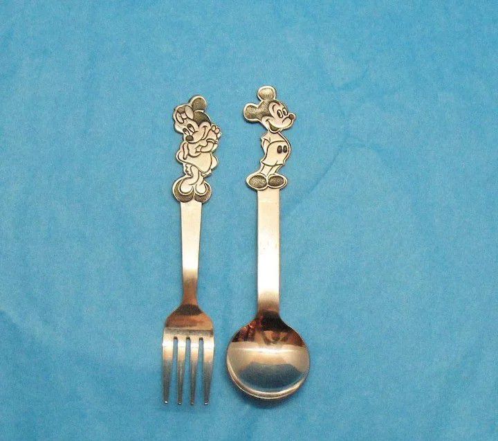 Vintage Mickey and Minnie mouse silverware spoon and fork from the 1950-60s still in good condition. The spoon and fork are both 5 ½ inches long and m