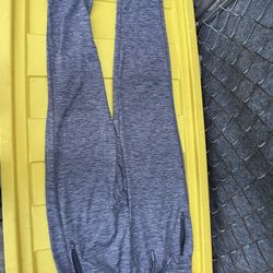The sports pants in the image appear to be leggings or marly gray joggers,