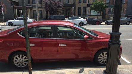 Red Nissan Sentra 4-Door Sedan