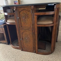 Kitchen buffet table, Counter height, beveled oval top, I think it’s marble.  Space saver,  well built with two sturdy chairsf.  Hand painted, in Exce