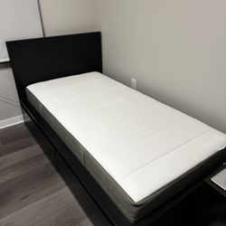 Ikea twin bed with black frame 