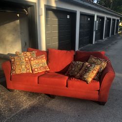 TWO PIECE SOFA / COUCH / SLEEPER / LOVE SEAT / BURGUNDY & GREEN COLOR FABRIC / IN GOOD CONDITION / DELIVERY NEGOTIABLE 