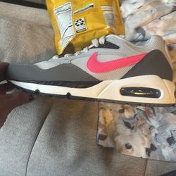 Nike Air grey white and pink Nike sign