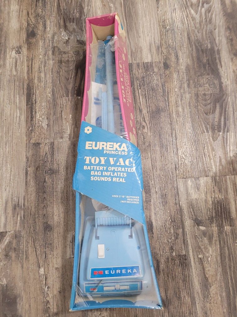 Vintage Eureka toy vacuum toy. New in box ( box is torn)