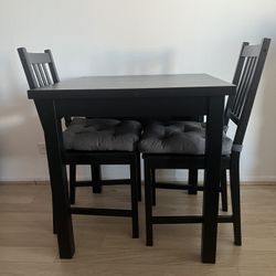 Two Chairs And Dining Table With Expanding Leaf