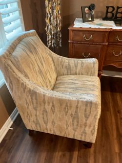 Ikat  pattern arm chair with nailed trim