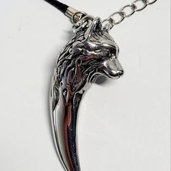 Viking Themed 18" Silver-toned Wolf/Fang Pendant Black Rope Necklace Symbolism. Like New Condition. Lighting may affect the true silver color. This Vi