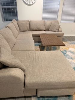 3 Piece Sectional Couch Sand Color with coffee table and carpet