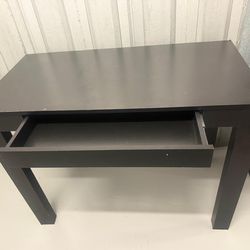 Mesa moderna negra con cajón deslizante minimalista