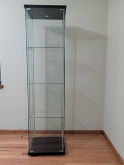 Three glass shelf cabinet