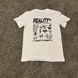 Bold oversized graphic tee featuring “REALITY / Decisive Moment” design with dice, butterflies, and statement text. Perfect for Y2K, techwear, and str