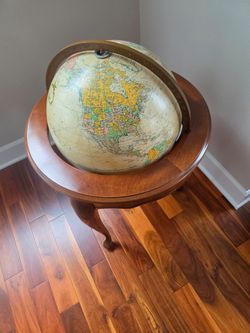 Globe on stand with cord and light