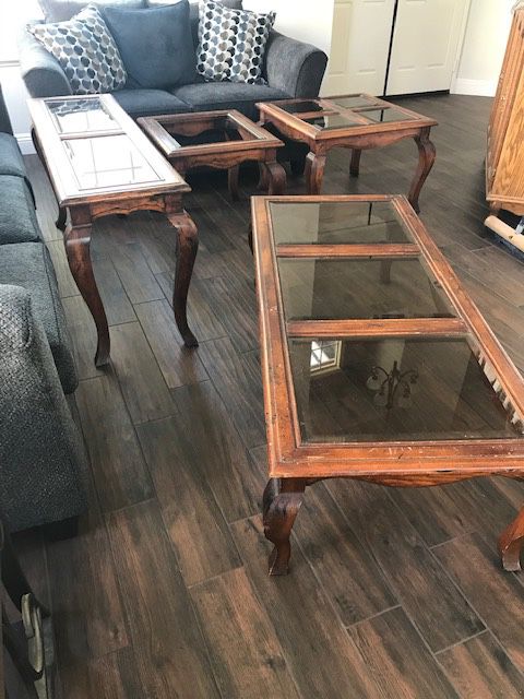 Two end tables, one coffee table and one sofa table.