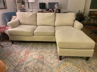 White Living Spaces 84” Sectional Sofa with Reversible Chaise