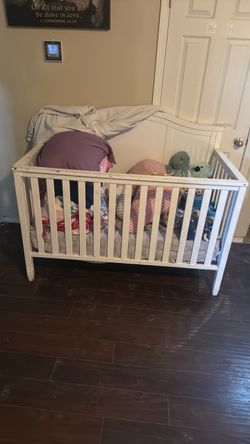White crib with mattress