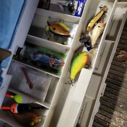 Fishing Poles And Tackle Box W Alot Of New Things In It