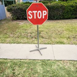 antique stop sign with stand