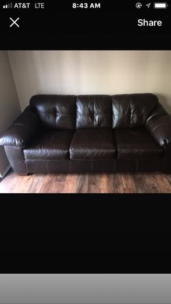 Black sofa and love seat set in good condition only the sofa has a crack in it