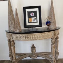 Black marble top table. Gold tone base. 