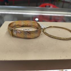 14k Gold brealte with diamond around it different prices and different grams layaway available 10% down if you interested please make sure you ask for