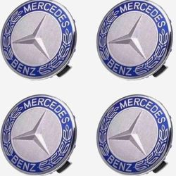 4 Mercedes Benz rim center caps.  SEE ALL PICS 4 MORE MERCEDES SOLD SEPARATELY. SHIPPING AVAILABLE
