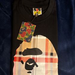 BAPE black t-shirt with multi-coloured graphic